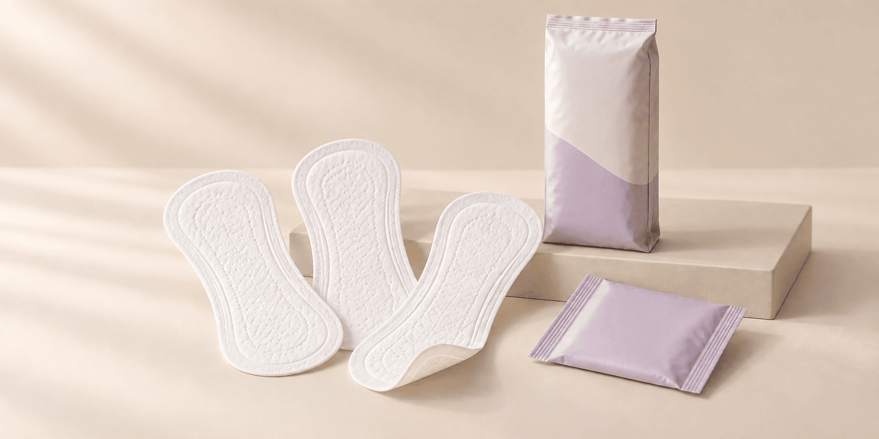 Illustrative panty liners samples with an unbranded pastel pack.