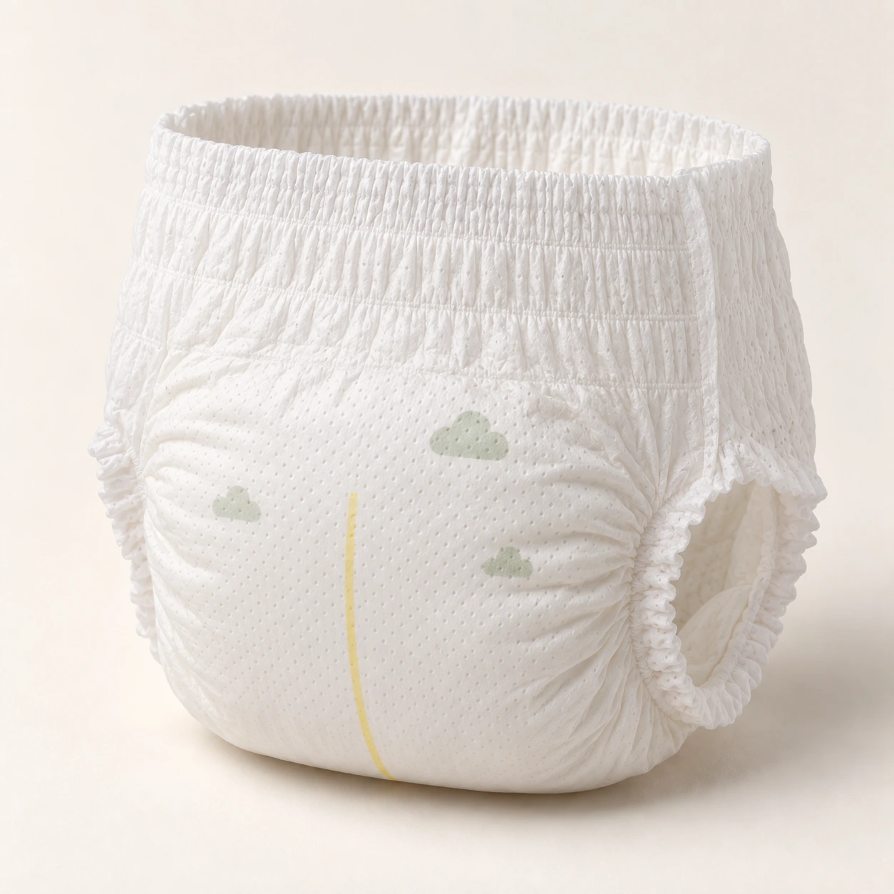 Illustrative white baby pull-on pant, front three-quarter view, with a gathered waist, sage cloud print and yellow wetness line.